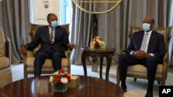 FILE — Sudan's army chief Gen. Abdel Fattah al-Burhan meets Eritrean President Isaias Afwerki in Khartoum, May 4, 2021. 