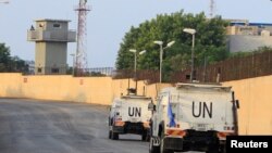 FILE - U.N. peacekeepers (UNIFIL) vehicles are pictured in Naqoura, near the Lebanese-Israeli border, southern Lebanon, Oct. 29, 2020. 