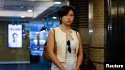 Selina Cheng, the newly elected chair of the Hong Kong Journalists Association, leaves office after her employment contract with the Wall Street Journal was terminated, in Hong Kong on July 17, 2024.