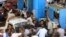 People argue at a petrol station during a fuel shortage in Cairo, June 26, 2013.