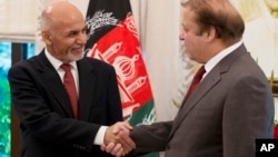 FILE - Pakistani Prime Minister Nawaz Sharif (R) receives Afghan President Ashraf Ghani in Islamabad, Pakistan, Nov. 15, 2014.