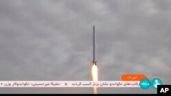 This image taken from video aired by Iranian state television on Sept. 27, 2023, shows what Iran's Communication Minister Isa Zarepour said is a Noor-3 satellite being launched from an undisclosed location in Iran. (IRIB via AP)