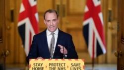 In this photo made available by 10 Downing Street, Britain's Foreign Secretary Dominic Raab gestures during a coronavirus media briefing at 10 Downing Street, in London, April 16, 2020.