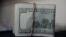 FILE - A view of U.S. dollar bills