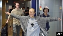 Liu Xia, the widow of Chinese Nobel dissident Liu Xiaobo, smiles as she arrives at the Helsinki International Airport in Vantaa, Finland, on July 10, 2018.