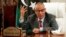 FILE - Libya's Prime Minister Ali Zeidan speaks during a joint news conference with Oil Minister Abdelbari al-Arusi at the Prime Minister's Office in Tripoli, July 31, 2013.