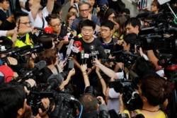 Pro-democracy activist Joshua Wong talks to the media outside the Legislative Council during a demonstration in Hong Kong, June 17, 2019.