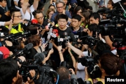 Pro-democracy activist Joshua Wong talks to the media outside the Legislative Council during a demonstration in Hong Kong, June 17, 2019.