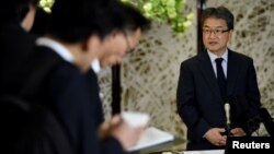 FILE - U.S. Special Representative for North Korea Policy Joseph Yun, right, answers questions from reporters.