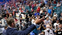 Eric Trump, the son of President Donald Trump, waves to supporters before a rally in Tulsa, Okla., Saturday, June 20, 2020. (AP Photo/Sue Ogrocki)