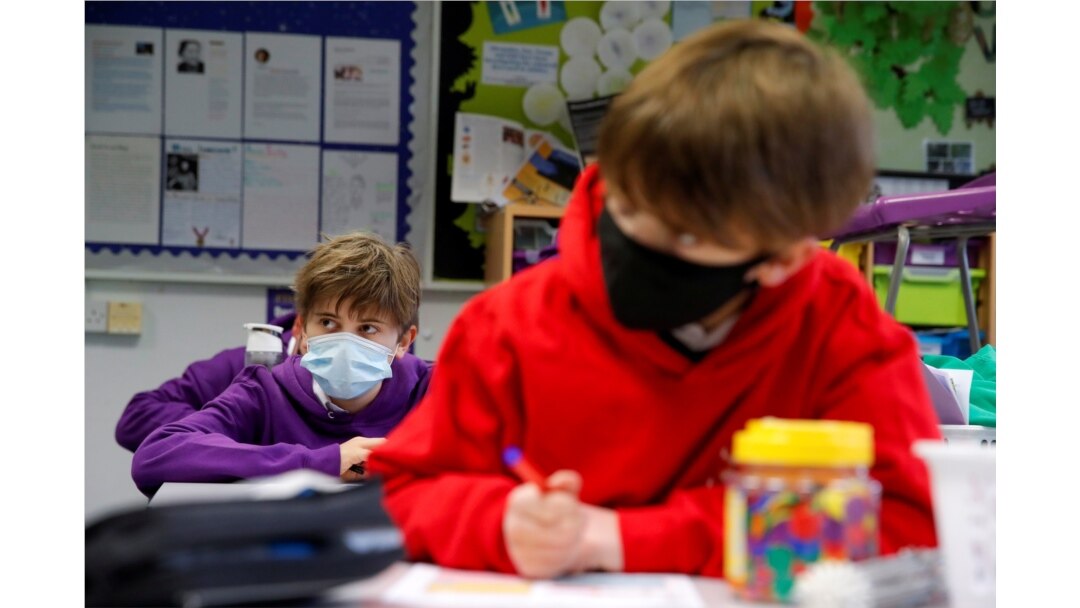 Students listen to a teacher during a lesson at Heath Mount school as schools reopen in England, amid the coronavirus pandemic, in Watton at Stone, Hertfordshire, Britain, March 8, 2021.