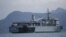 FILE - A Malaysian navy vessel patrols waters near Langkawi Island, May 16, 2015. Malaysia is buying four ships from China to help it patrol its coastline.