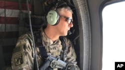 FILE - U.S. Army Lt. Gen. Stephen Townsend watches during a tour north of Baghdad, Iraq, In this eb. 8, 2017. 