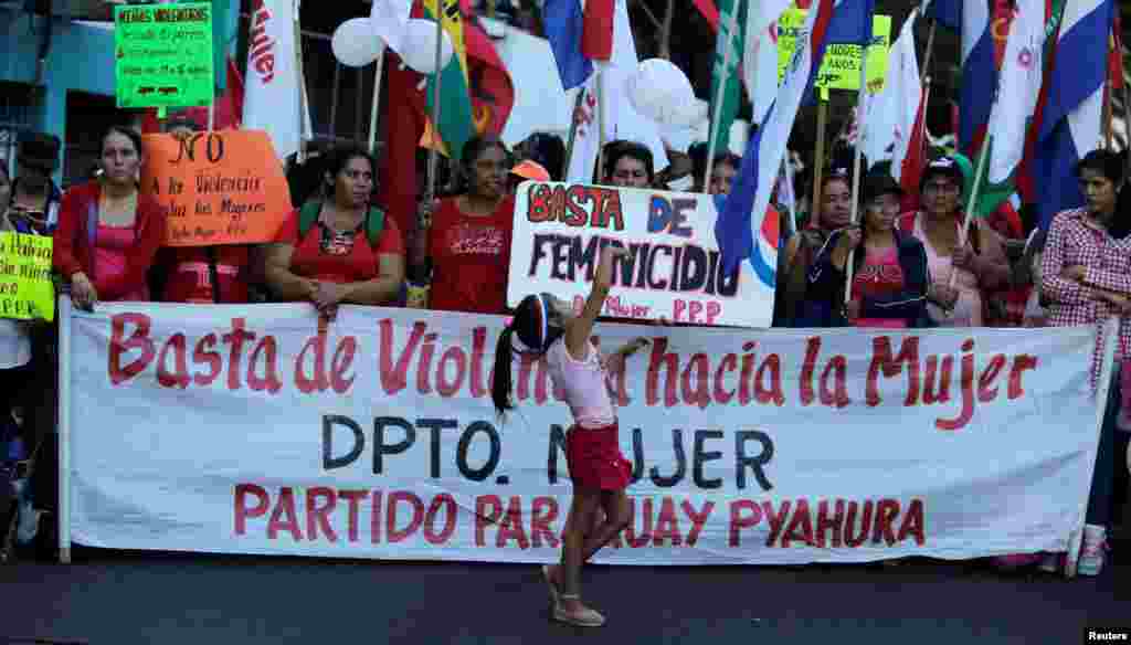 Social activists protest in front of the Health Ministry to demand the end of violence against women and better health care for women, as the world celebrates &quot;International Women&#39;s Day&quot; in Asuncion, Paraguay, March 8, 2017.