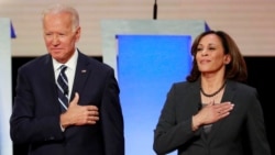 FILE - Former Vice President Joe Biden and U.S. Senator Kamala Harris take the stage before the start of the second night of the second U.S. 2020 presidential Democratic candidates debate in Detroit, Michigan, U.S., July 31, 2019.