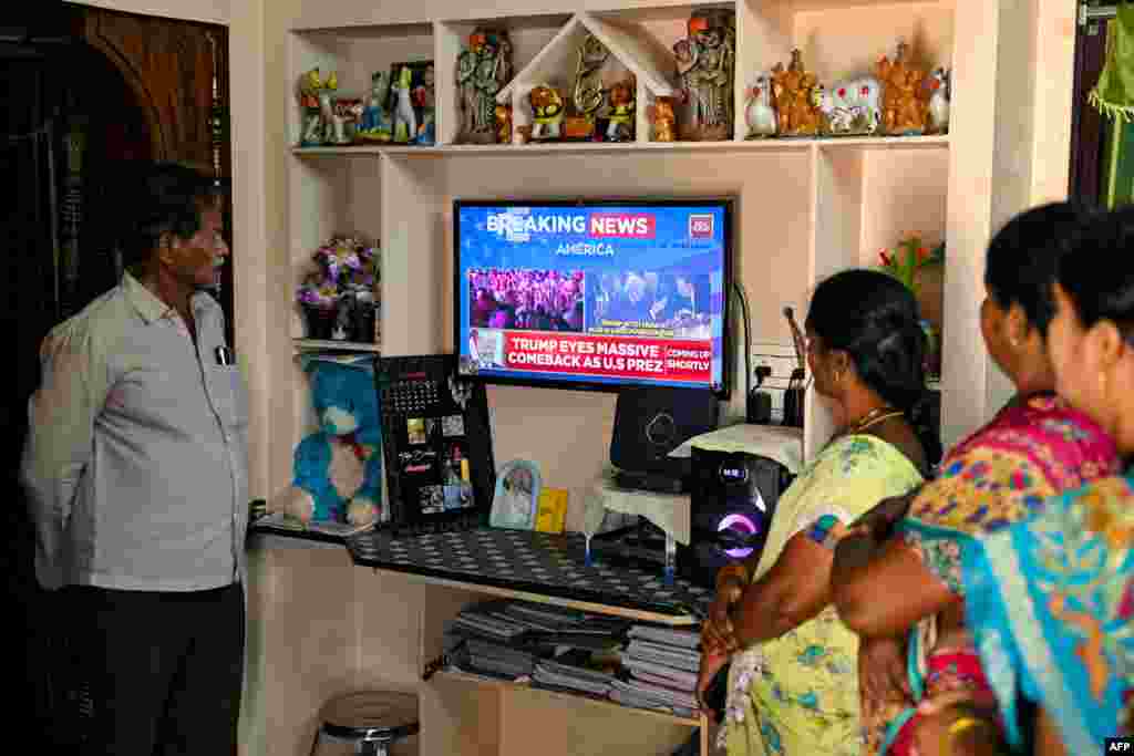 Villagers watch the 2024 U.S. presidential election poll results inside a house in Vadluru, the ancestral village of Usha Vance&#39;s parents, wife of U.S. Senator and Republican vice presidential candidate JD Vance, at the West Godavari district in India&#39;s Andhra Pradesh state on Nov. 6, 2024.