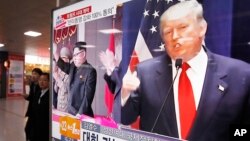 FILE - A TV screen shows pictures of U.S. President Donald Trump (right) and North Korean leader Kim Jong Un, at the Seoul Railway Station in Seoul, South Korea, Nov. 10, 2016. 