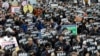 FILE - Demonstrators supporting the MeToo movement in black stage a rally to mark the International Women's Day in Seoul, South Korea, March 8, 2018. 