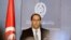 FILE - Tunisia's then-Prime Minister-designate Youssef Chahed speaks during a news conference in Tunis, Tunisia, Aug. 3, 2016. 