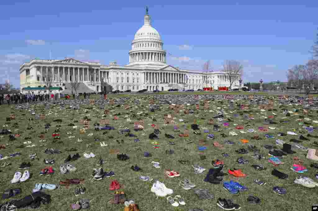 7000 pairs of shoes, one for every child killed by gun violence since the Sandy Hook school shooting, were placed on the Capitol lawn by Avaaz, a U.S.-based civic organization, on Capitol Hill in Washington.