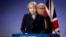 European Commission President Jean-Claude Juncker, right, walks behind British Prime Minister Theresa May prior to addressing a media conference at EU headquarters in Brussels, Dec. 4, 2017.