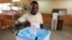 A man casts his ballot at a voting station in Kicolo, Luanda, Angola, August 31, 2012.