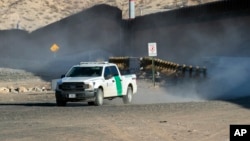 A U.S. Border Patrol truck rides along the border wall in Sunland Park, New Mexico, Jan. 20, 2025.