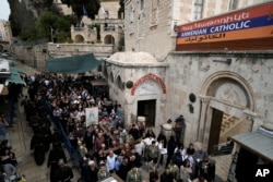 FILE—Christians walk the Way of the Cross procession that commemorates Jesus Christ's crucifixion on Good Friday, in the Old City of Jerusalem, March 29, 2024.