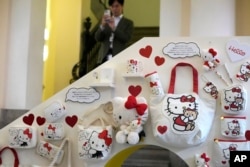 A visitor looks at Hello Kitty display at the exhibition "As I change, so does she," marking the 50th anniversary of Hello Kitty at the Tokyo National Museum in Tokyo, Oct. 30, 2024.