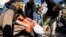 FILE - Protesters simulate the use of waterboarding on a volunteer at an anti-torture rally in front of the Justice Department in Washington, Nov. 5, 2007.