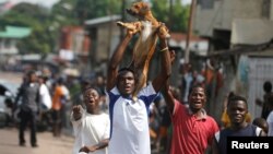 Des militants de l'opposition manifestent contre le président Joseph Kabila, à Kinshasa, en RDC, le 19 décembre 2016.