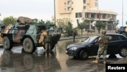 Lebanese army soldiers man a checkpoint as they are deployed in Tripoli, northern Lebanon, Dec. 3, 2013.