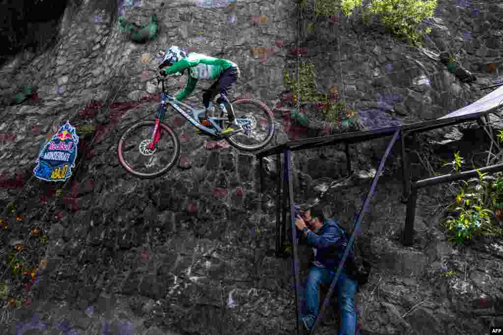 Colombian cyclist Camilo Sanchez is seen in action during the Red Bull Monserrate Cerro Abajo competition in Bogota, Feb. 6, 2021.