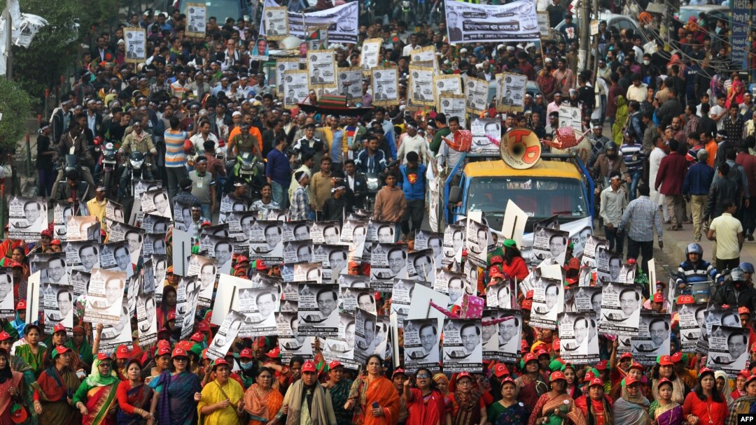 Supporters of Bangladesh Awami League march along a street as they take part in a rally ahead of Dec. 30 general election vote, in Dhaka, Dec. 27, 2018.