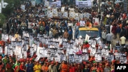 Supporters of Bangladesh Awami League march along a street as they take part in a rally ahead of Dec. 30 general election vote, in Dhaka, Dec. 27, 2018.