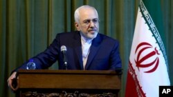 Iranian Foreign Minister Mohammad Javad Zarif listens to a question during a press conference with his German counterpart Frank-Walter Steinmeier in Tehran, Iran, Saturday, Oct. 17, 2015.