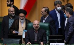 FILE - Mohammad Bagher Qalibaf speaks after being elected as speaker of the parliament, in Tehran, Iran, May 28, 2020.