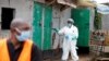 A Nairobi municipality worker sprays disinfectant in an effort to fight against the spread of the COVID-19 in the Kawangware neighborhood of Nairobi, Kenya, May 2, 2020.