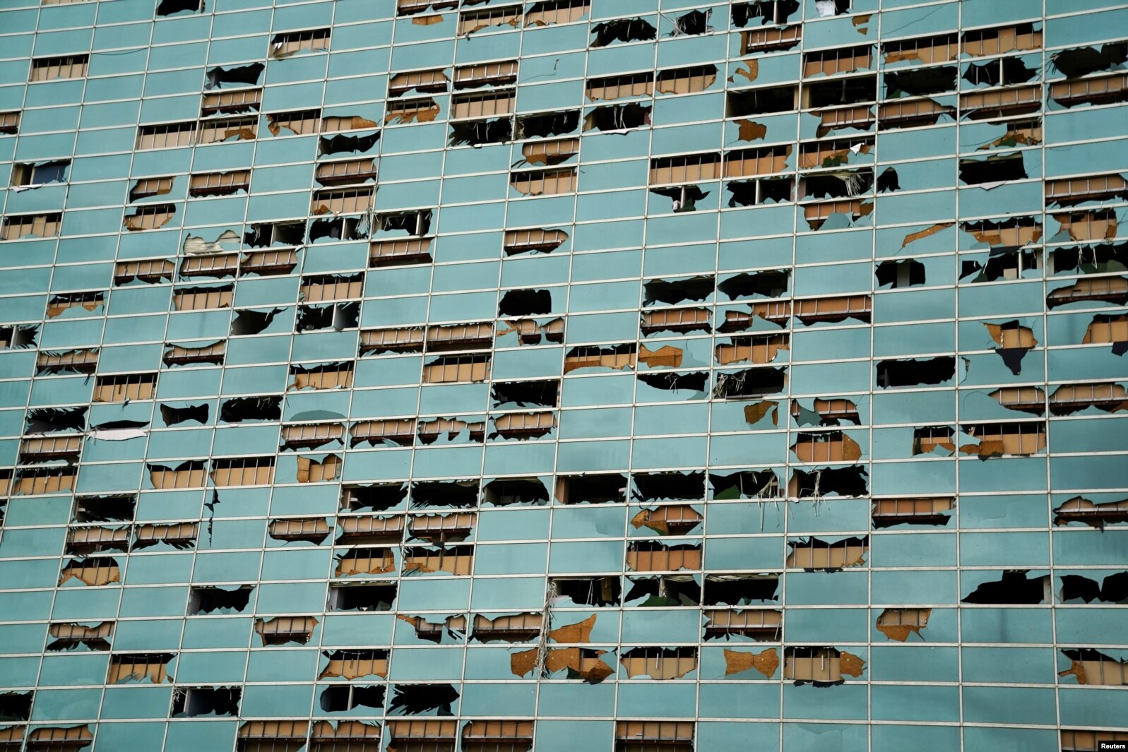 The facade of a building is seen damaged after Hurricane Laura passed through Lake Charles, Louisiana.