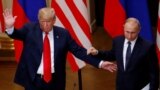 U.S. President Donald Trump and Russian President Vladimir Putin react at the end of the joint news conference after their meeting in Helsinki, Finland, July 16, 2018. 