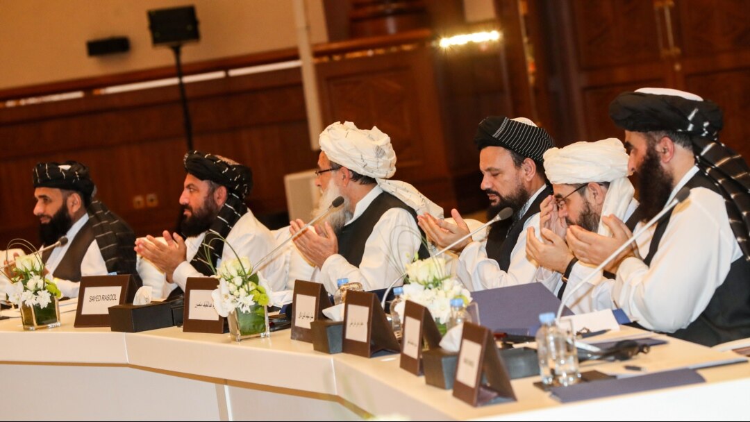 FILE - Members of the Taliban attend Intra Afghan Dialogue talks in the Qatari capital, Doha, July 8, 2019.