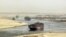 FILE - cargo ships sail through the Suez Canal near Ismailia, Egypt. 