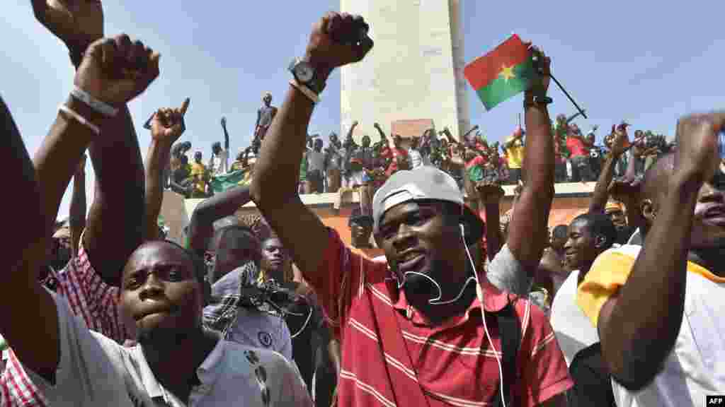 People celebrate in the capital Ouagadougou after Burkina Faso's embattled President Blaise Compaore announced he was stepping down, Oct. 31, 2014.