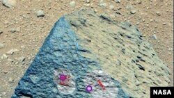 This image shows where NASA's Curiosity rover aimed two different instruments to study a rock known as "Jake Matijevic." (NASA/JPL-Caltech/MSSS)