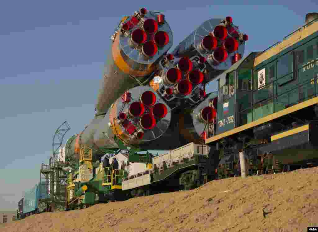 The Soyuz rocket is rolled out to the launch pad by train at the Baikonur Cosmodrome in Kazakhstan, (NASA/Carla Cioffi).