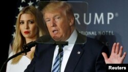 FILE - Then-Republican presidential nominee Donald Trump and his daughter Ivanka Trump attend a campaign event in Washington.