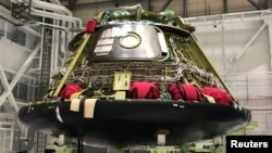 FILE - One of Boeing Co's CST-100 Starliner astronaut capsules is seen at a production facility in Cape Canaveral, Florida, Jan. 15, 2019. 