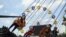 Visitors enjoy a ride at Kabul City Park in Kabul, Afghanistan, July 24, 2020. 