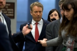 Sen. Rand Paul, R-Ky., talks to reporters before attending the impeachment trial of President Donald Trump on charges of abuse of power and obstruction of Congress, on Capitol Hill in Washington, Jan. 28, 2020.