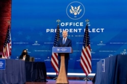 FILE - President-elect Joe Biden, accompanied by Vice President-elect Kamala Harris, speaks at a news conference to introduce their nominees and appointees to economic policy posts at The Queen theater, Dec. 1, 2020, in Wilmington, Del.